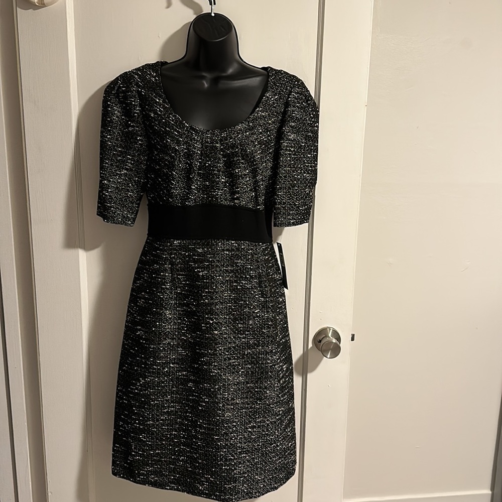 Mid sleeve cocktail dress.  Never worn.  Tag still in place.